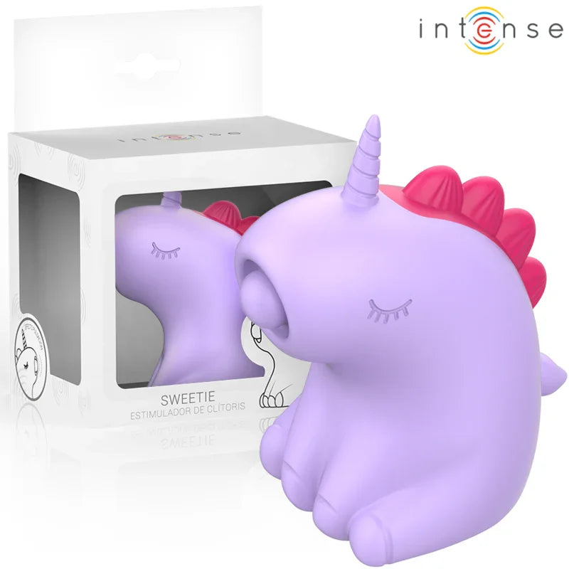 Estimulador de lengua unicornio morado con cuerno y orejas rosas, visto en caja